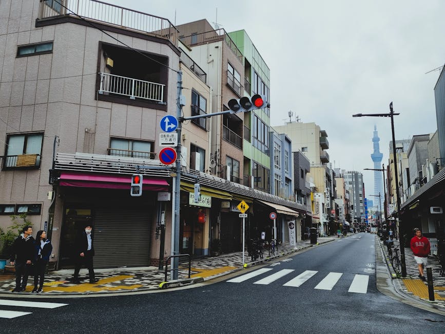 A quiet street in Tokyo with shops and buildings lining the road